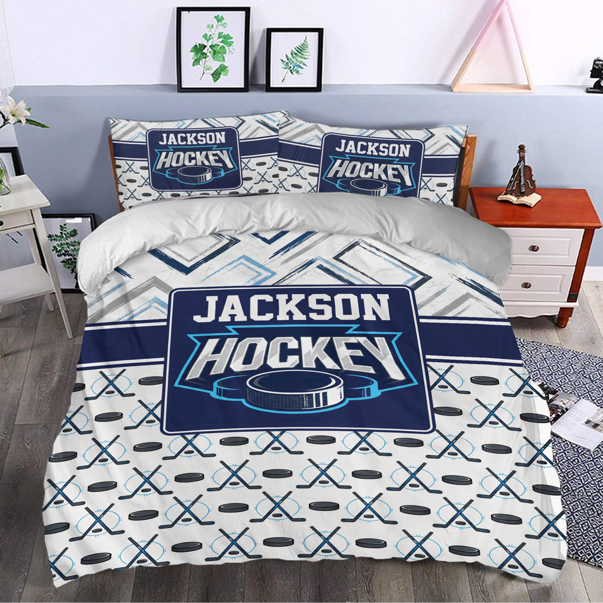 Hockey bedding set styled in a bedroom with crossed sticks, pucks, and bold navy graphics