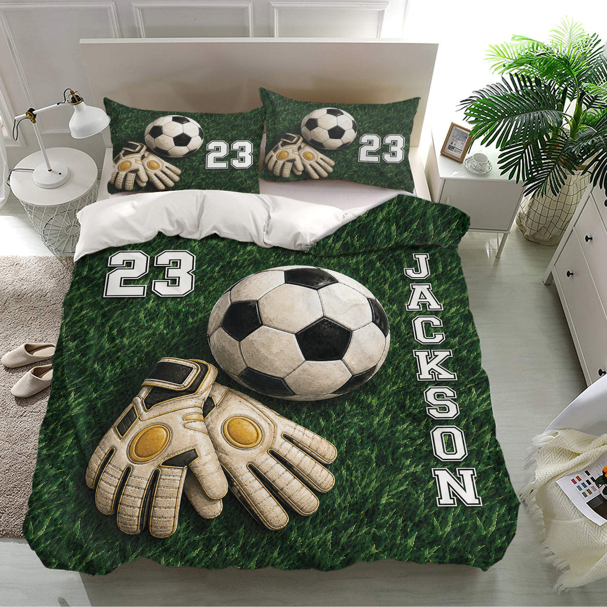 Soccer bedding set in a bright bedroom featuring green field artwork, soccer balls, and goalkeeper gloves