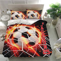 Soccer bedding set with large black, white, red, and orange ball artwork on a bedroom bed