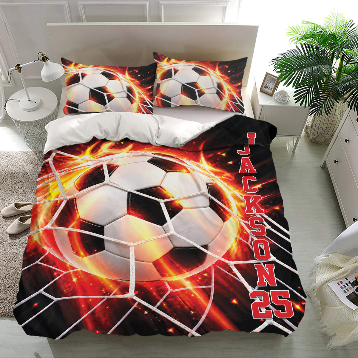 Soccer bedding set with large black, white, red, and orange ball artwork on a bedroom bed