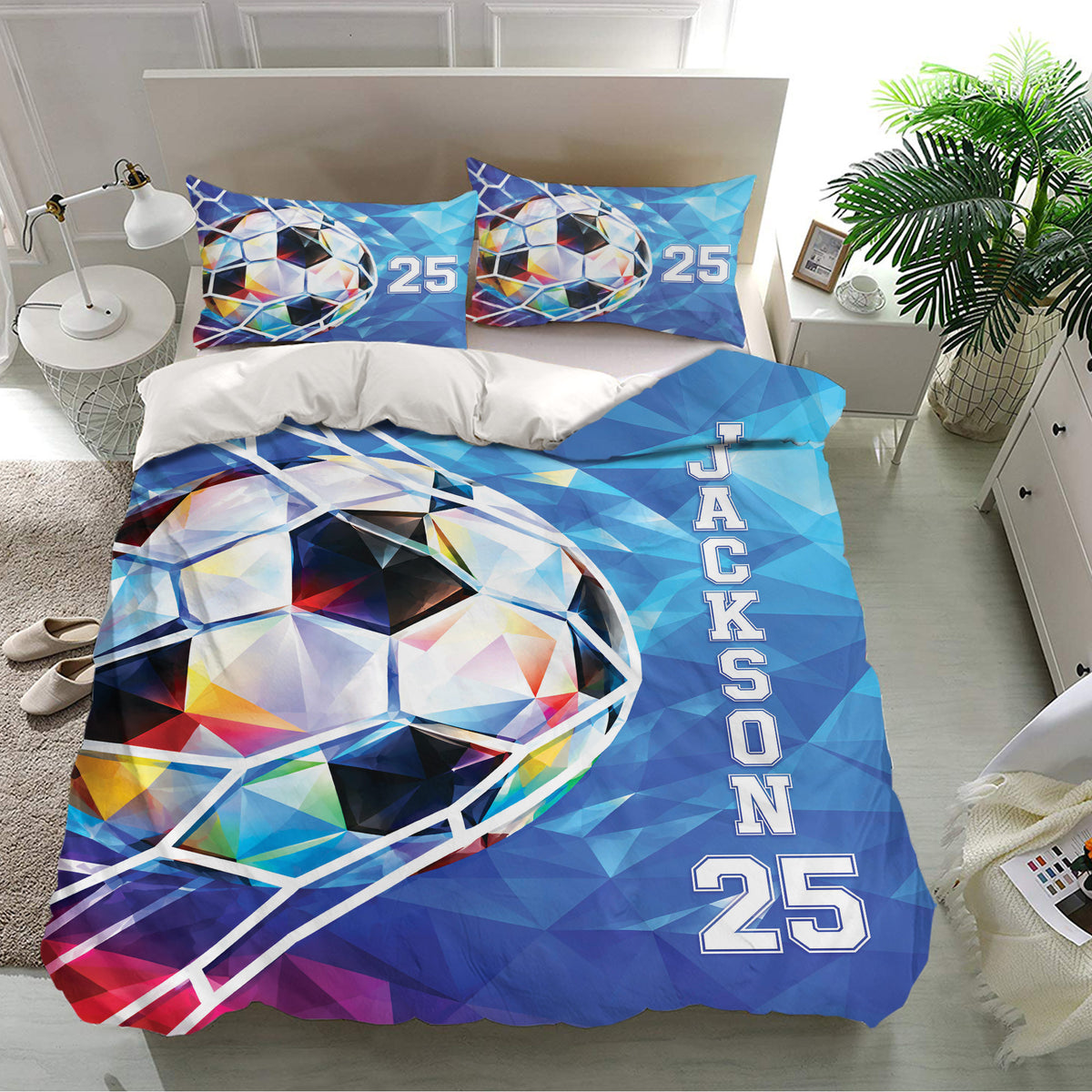 Blue geometric soccer bedding set displayed in a bright bedroom with matching pillowcases