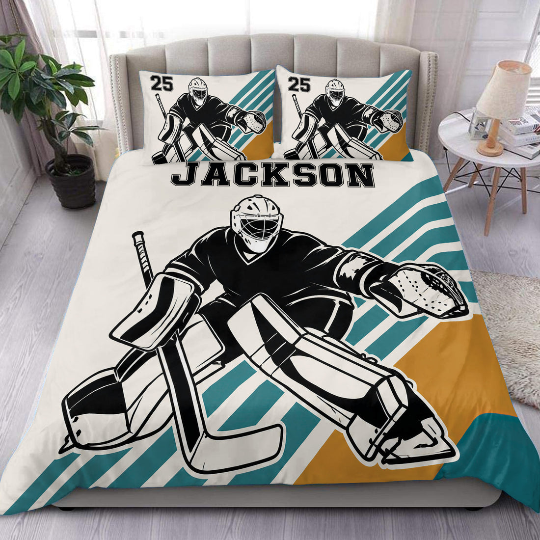 Hockey goalie duvet cover set displayed on a bed with teal, gold, black, and white graphics