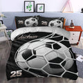 Soccer duvet cover set styled in a bedroom with dramatic black and white ball artwork