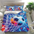 Soccer bedding set on a bright bedroom bed with matching pillowcases and colorful geometric ball design