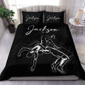 Black wrestling duvet cover set displayed on a bed with grappling artwork and matching pillows