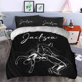 Black wrestling bedding set styled in a modern bedroom with grappling artwork and matching pillows