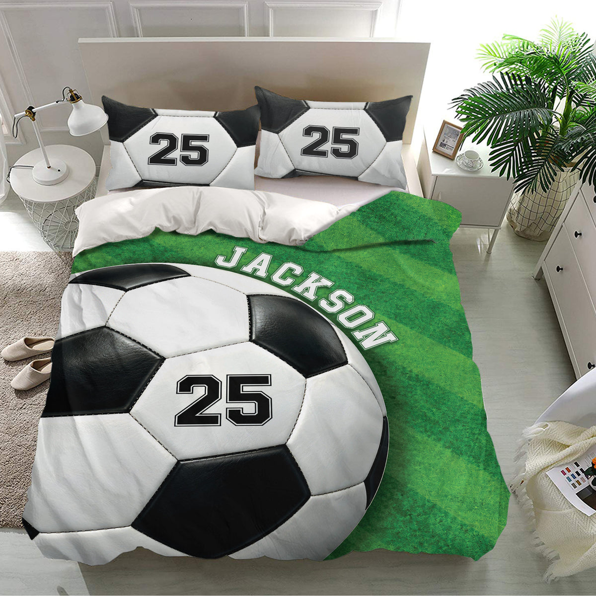 Soccer bedding set styled in a bright bedroom with green field graphics and black and white soccer balls