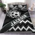 Black and white soccer duvet cover set displayed on a modern bed with matching custom pillowcases