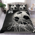 Black and white soccer duvet cover set styled on a bed with matching soccer ball pillowcases
