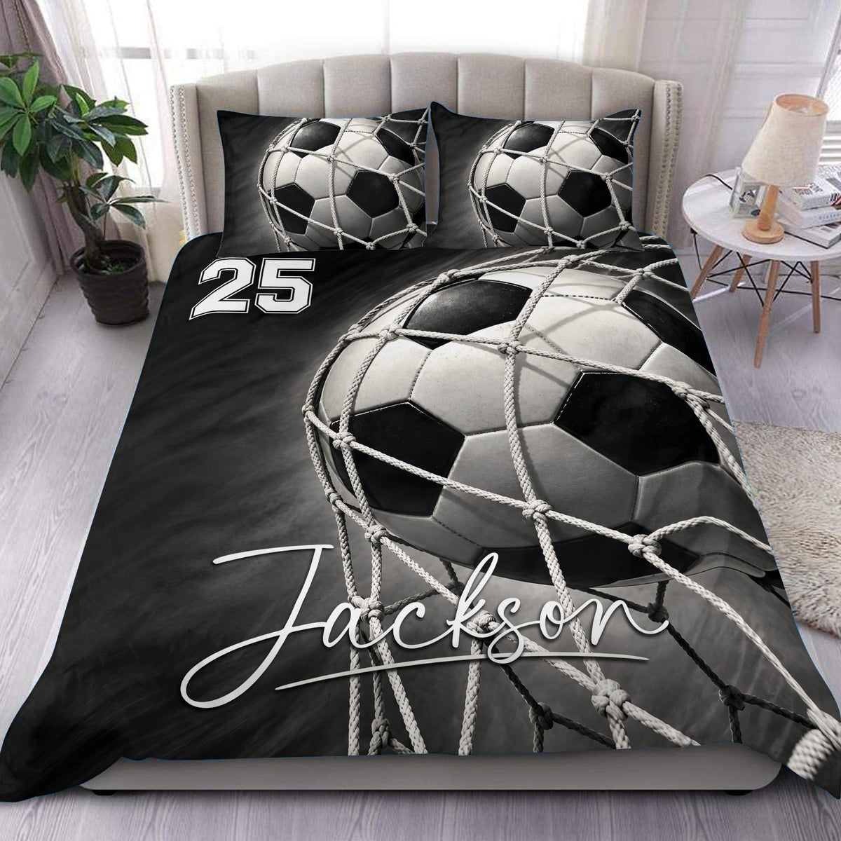 Black and white soccer duvet cover set styled on a bed with matching soccer ball pillowcases