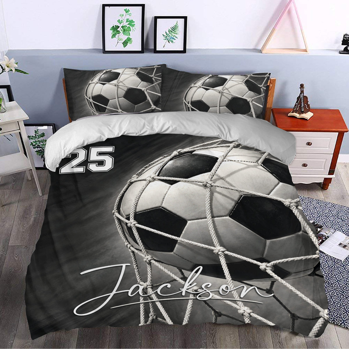 Soccer duvet cover set styled in a modern bedroom with bold black and white ball artwork