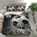Black and white soccer duvet cover bedding set displayed in a bright contemporary bedroom