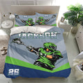 Lacrosse bedroom decor featuring a blue duvet cover set with green player artwork and matching lacrosse pillowcases