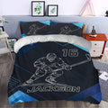 Hockey bedding set styled in a bedroom with an ice hockey player, stick, skates, and blue geometric accents