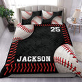 Baseball duvet cover set displayed on a bed with black textured artwork, red stitching, and baseball graphics