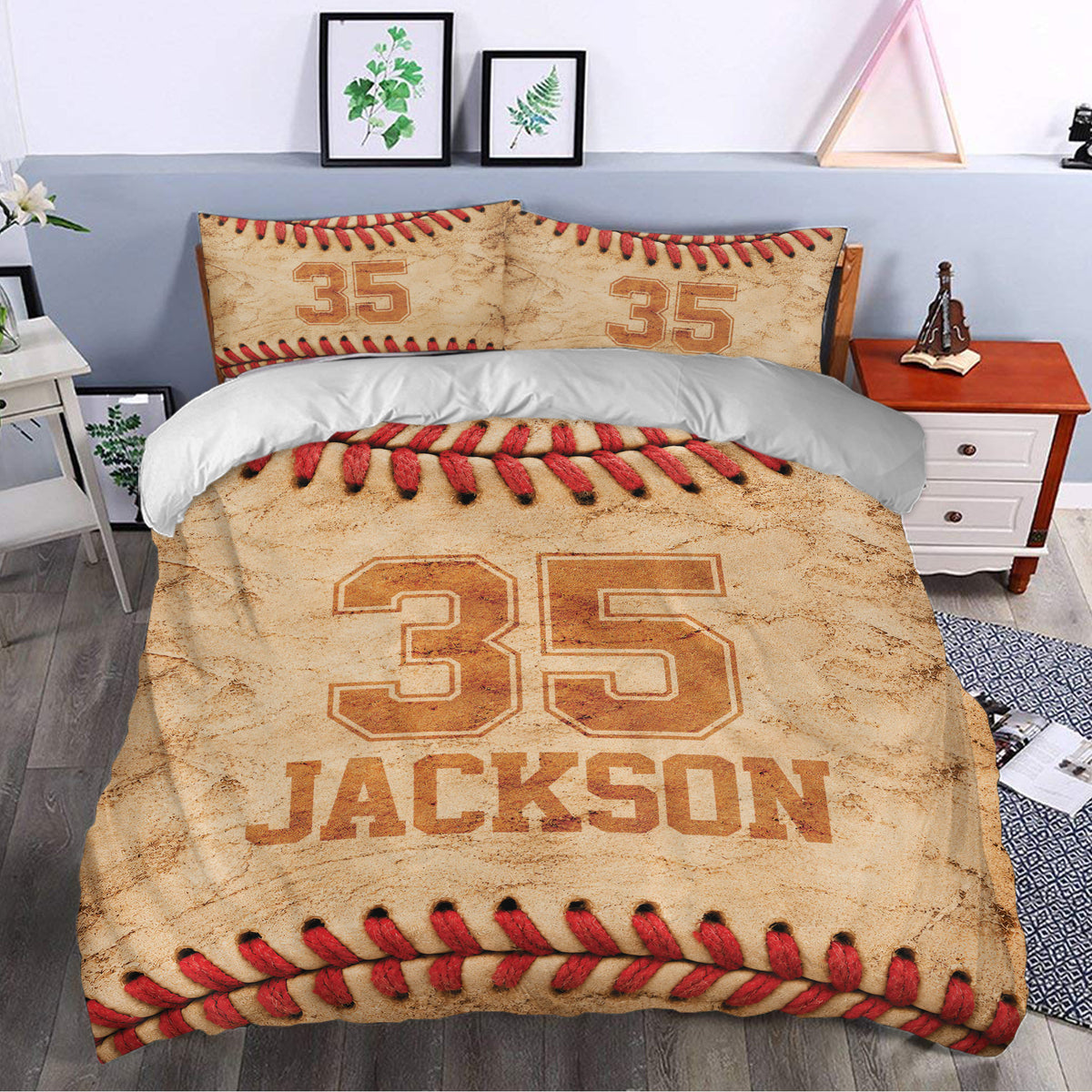 Baseball bedding displayed in a modern bedroom with red stitching, tan texture, and bold sports-inspired artwork