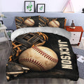 Baseball bedding styled in a bedroom with bold dark artwork, vintage gloves, and oversized stitched baseball graphics