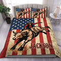 Rodeo duvet cover set displayed on a bed with a cowboy riding a bucking bull over a rustic flag design
