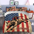 Rodeo duvet cover set styled in a bedroom with cowboy and bucking bull artwork in red, cream, and navy
