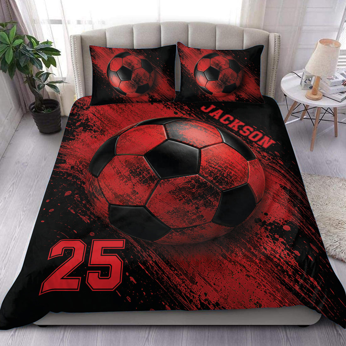 Red and black soccer duvet cover bedding set styled on a modern bed with bold ball artwork