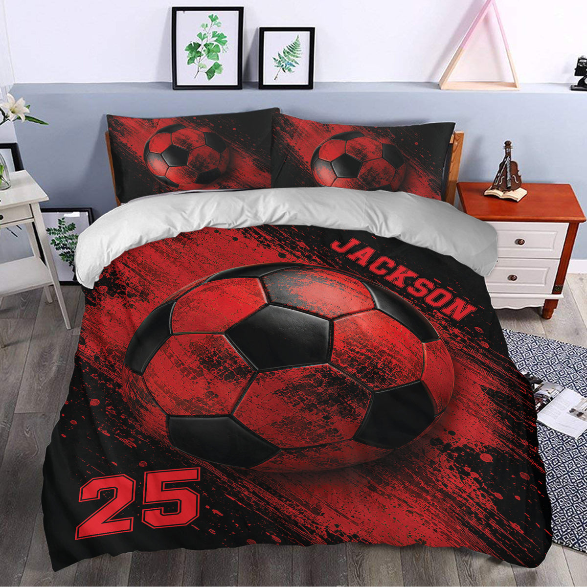 Red and black soccer duvet cover styled in a bedroom with dramatic ball artwork and sports decor