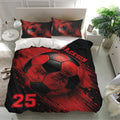 Soccer bedding set displayed in a bright bedroom with large red and black ball artwork