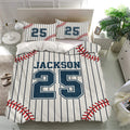 Baseball bedding set displayed in a bright bedroom with matching pillowcases, red stitching, and navy pinstripes