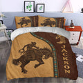 Rodeo duvet cover set styled on a bed with cowboy, horse, boot, and rustic Western bedroom decor