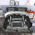 Trucker bedding styled in a bedroom with chrome semi truck artwork, black tones, and rugged rock accents