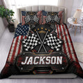 Racing duvet cover set displayed on a bed with crossed checkered flags and bold red, white, blue, and black artwork