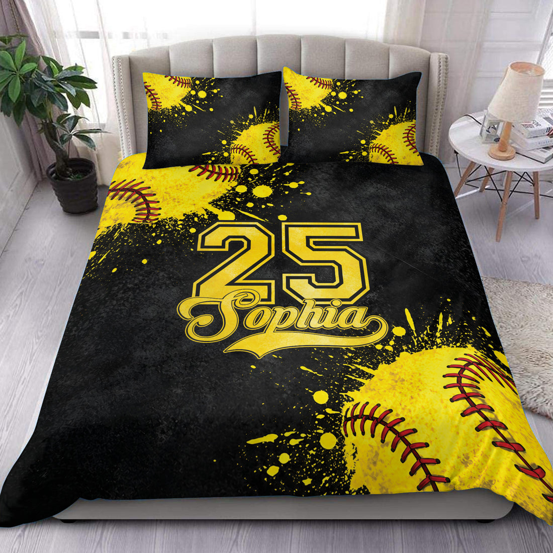 Softball duvet cover set displayed on a bed with bold yellow balls, black splatter artwork, and sporty bedroom style