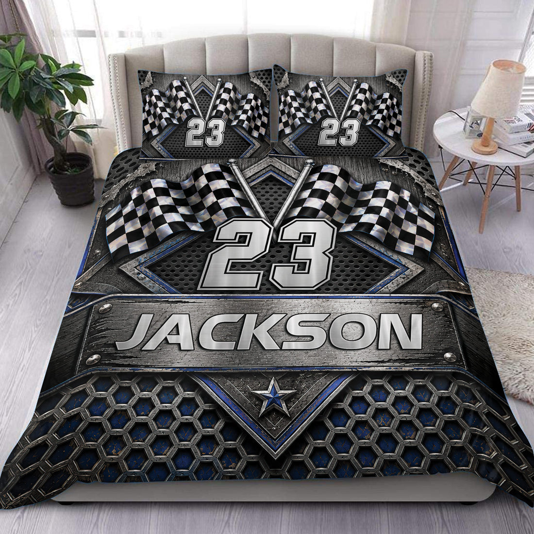 Racing duvet cover set displayed on a bed with checkered flags, metallic details, and bold blue accents