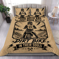 Tan motocross duvet cover set with dirt bike rider artwork and bold black racing graphics in a bedroom