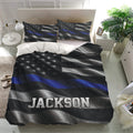 Police bedding set presented in a bright bedroom with matching pillowcases and bold thin blue line design