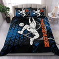 Basketball duvet cover set displayed on a bed with a dynamic dunking player, black, blue and orange design