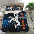 Black and blue basketball duvet cover bedding set styled in a bright bedroom with matching pillowcases