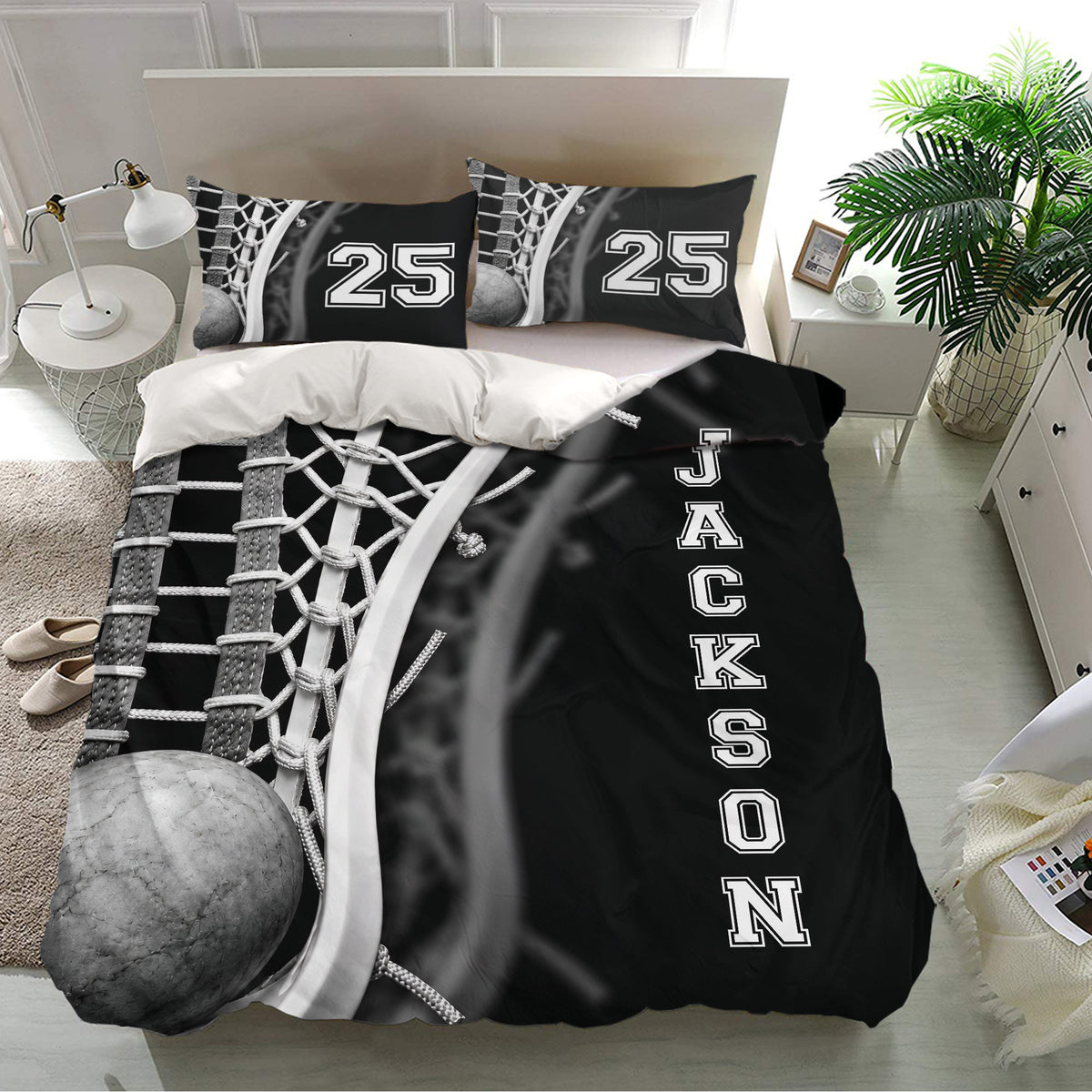 Lacrosse bedding set in a bright bedroom featuring a lacrosse ball, sticks, netting, and bold black design