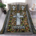 Custom hunting and fishing bedding set with silver Christian cross, deer antlers, fishing hook, woodland camouflage, Celtic knot borders and custom name.