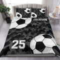 Soccer duvet cover set with black camouflage, soccer balls, custom name, and number design