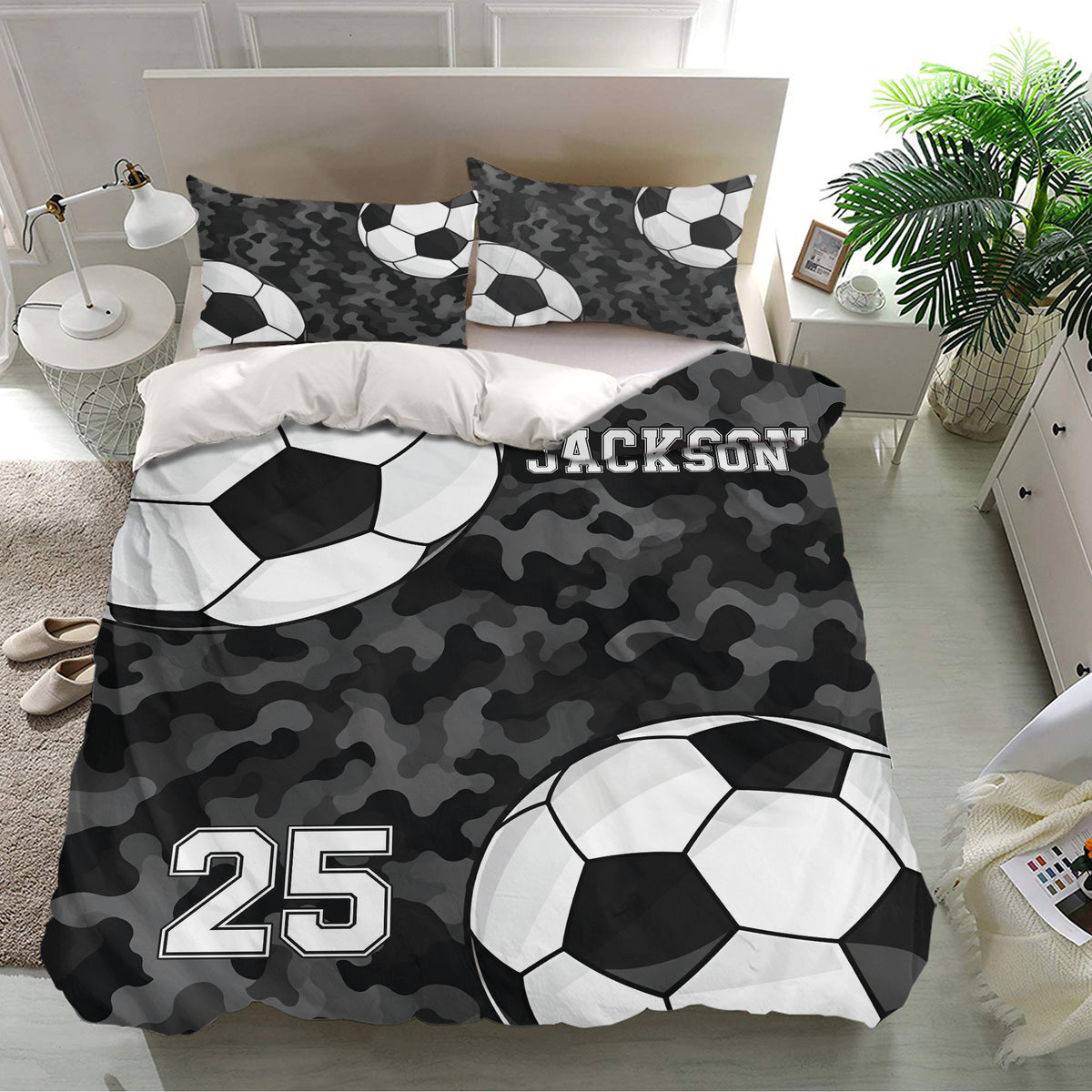 Black camouflage soccer duvet cover set displayed in a bright bedroom with matching soccer ball pillowcases