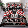 Racing duvet cover set with red and white checkered flags, metallic graphics, and bold black bedroom styling
