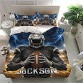 Football bedding displayed in a bright bedroom with matching player pillowcases and dramatic blue lightning design