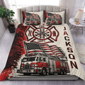 Firefighter duvet cover set displayed on a bed with red fire trucks, flags, and fire station emblem artwork