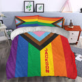 Colorful LGBT pride duvet cover set styled across a bedroom with matching rainbow flag pillowcases