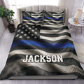 Police duvet cover set displayed on a bed with a distressed blue line flag design and custom text