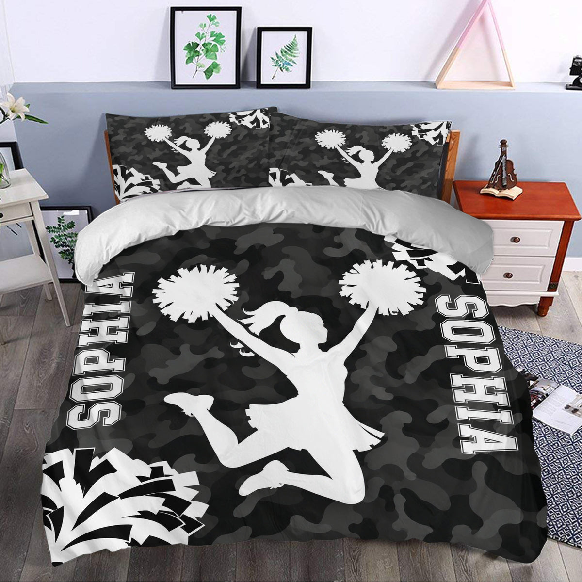 Black and white cheerleading duvet cover set styled in a modern bedroom with pom-pom artwork