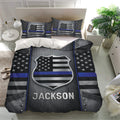 Police bedding set shown in a bright bedroom with matching badge pillowcases and bold thin blue line artwork