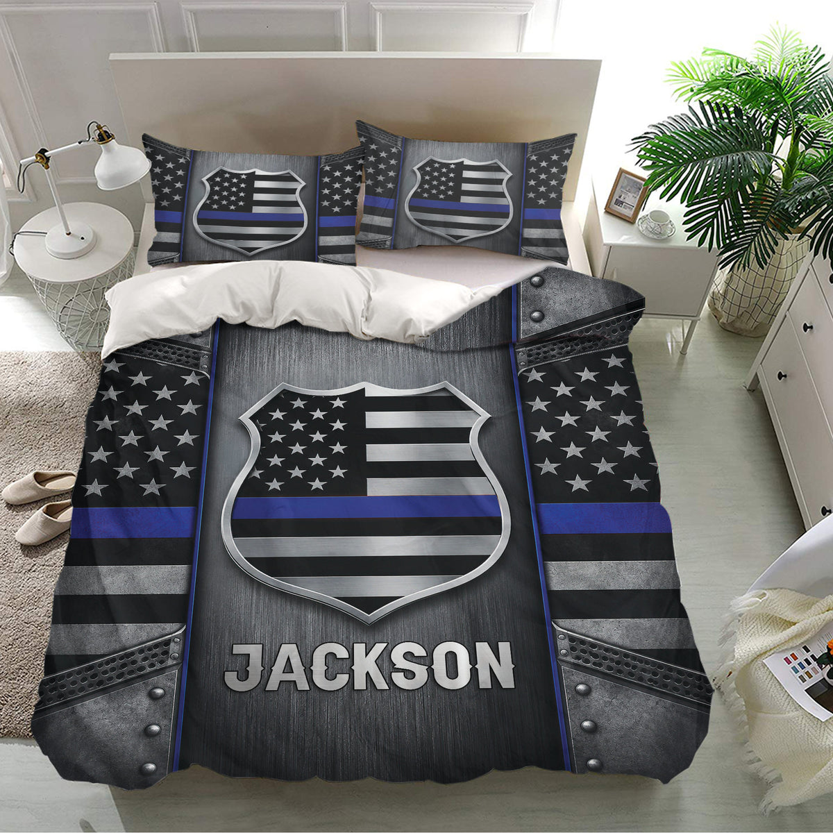 Police bedding set shown in a bright bedroom with matching badge pillowcases and bold thin blue line artwork