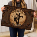 Lineman doormat held indoors, featuring a utility worker on a pole and detailed vintage-style border