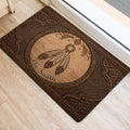 Dreamcatcher and feather entryway rug positioned beside a bright doorway on light flooring